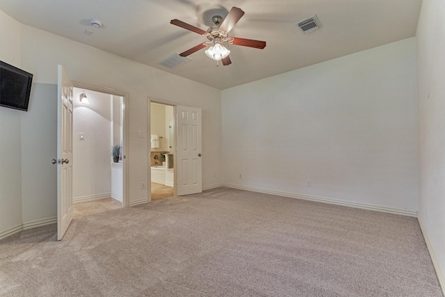 71 Ginger Jar St, The Woodlands, TX 77382 - unfurnished bedroom featuring light carpet, baseboards, and ensuite bath