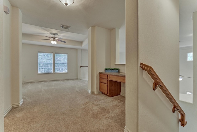 71 Ginger Jar St, The Woodlands, TX 77382 - corridor with light colored carpet, baseboards, and a desk