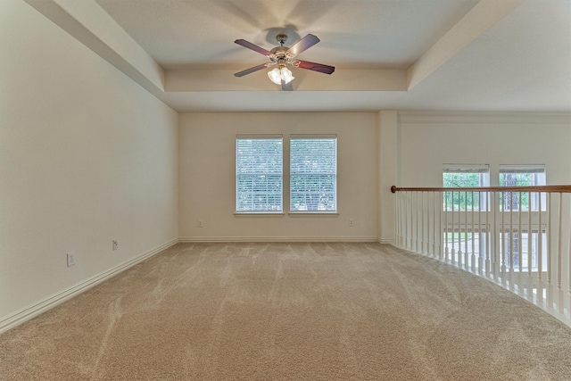 71 Ginger Jar St, The Woodlands, TX 77382 - carpeted spare room featuring a tray ceiling, ceiling fan, healthy amount of natural light, and baseboards