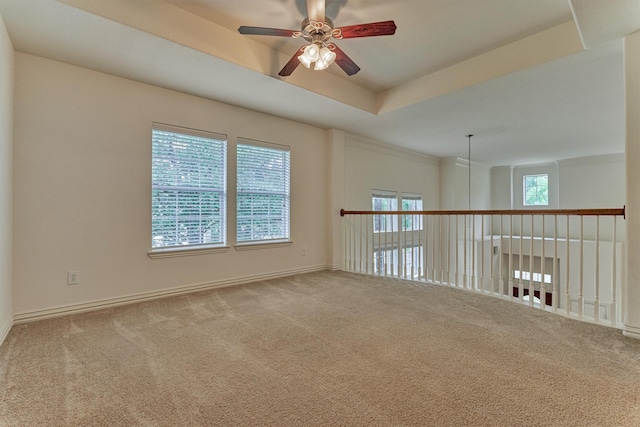 71 Ginger Jar St, The Woodlands, TX 77382 - carpeted empty room featuring ceiling fan, baseboards, and a tray ceiling