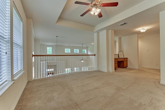 71 Ginger Jar St, The Woodlands, TX 77382 - spare room with a ceiling fan, light carpet, and baseboards