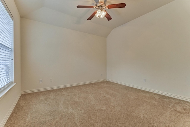 71 Ginger Jar St, The Woodlands, TX 77382 - unfurnished room with light carpet, lofted ceiling, a ceiling fan, and baseboards
