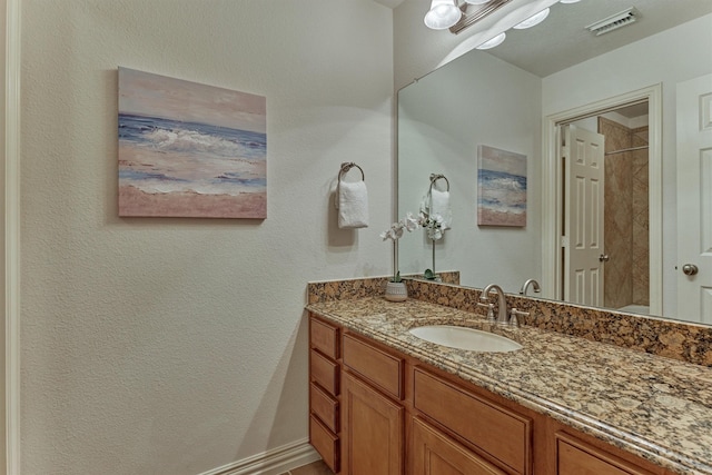 71 Ginger Jar St, The Woodlands, TX 77382 - full bath featuring vanity and a textured wall