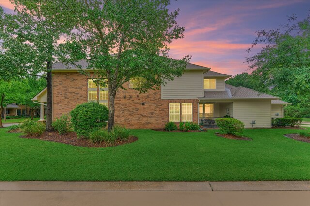 71 Ginger Jar St, The Woodlands, TX 77382 - view of front of house with brick siding and a yard