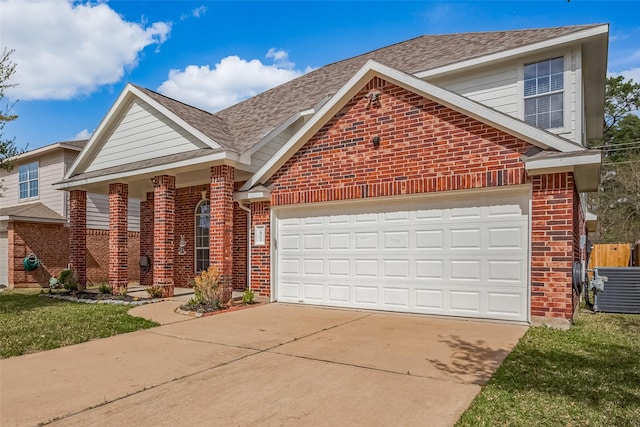 18314 Madisons Crossing Ln, Tomball, TX 77375 - traditional-style home featuring brick siding, concrete driveway, an attached garage, and a shingled roof