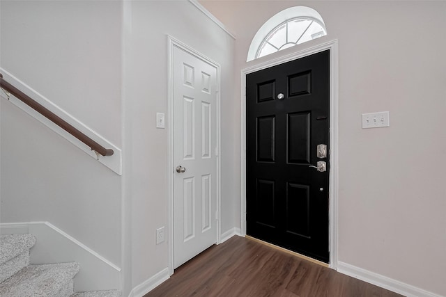 18314 Madisons Crossing Ln, Tomball, TX 77375 - foyer entrance featuring dark wood-type flooring, stairway, and baseboards