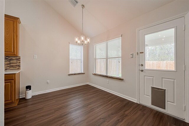 18314 Madisons Crossing Ln, Tomball, TX 77375 - unfurnished dining area with a chandelier, healthy amount of natural light, dark wood-style flooring, lofted ceiling, and baseboards