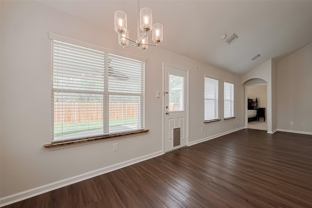 18314 Madisons Crossing Ln, Tomball, TX 77375 - entryway featuring lofted ceiling, arched walkways, a chandelier, dark wood-style floors, and baseboards