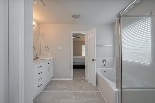 18314 Madisons Crossing Ln, Tomball, TX 77375 - ensuite bathroom with vanity, a garden tub, and a ceiling fan