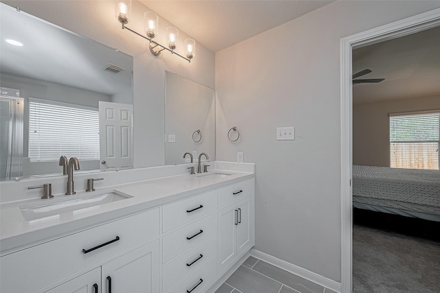 18314 Madisons Crossing Ln, Tomball, TX 77375 - bathroom with baseboards, tile patterned flooring, and double vanity