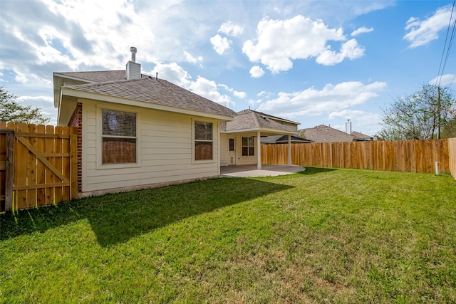 18314 Madisons Crossing Ln, Tomball, TX 77375 - back of house with a patio, a chimney, and a shingled roof