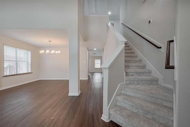 18314 Madisons Crossing Ln, Tomball, TX 77375 - stairs with wood finished floors, baseboards, and a chandelier