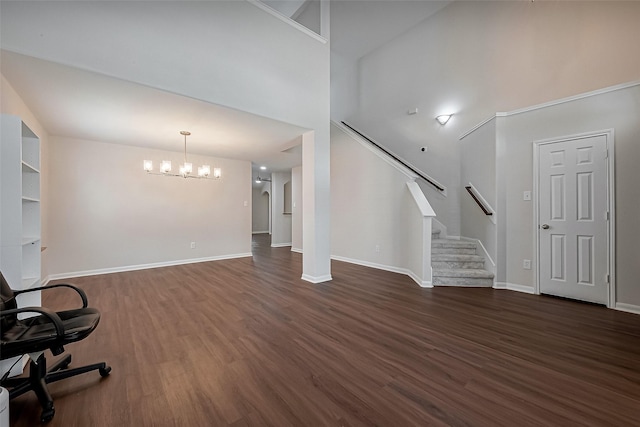 18314 Madisons Crossing Ln, Tomball, TX 77375 - foyer with a chandelier, dark wood-style flooring, stairway, baseboards, and a towering ceiling