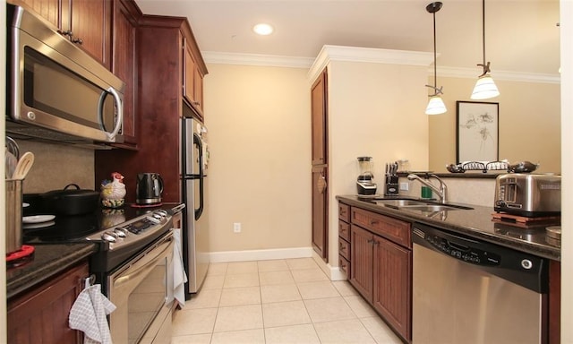 kitchen with stainless steel appliances, a sink, ornamental molding, decorative light fixtures, and light tile patterned floors