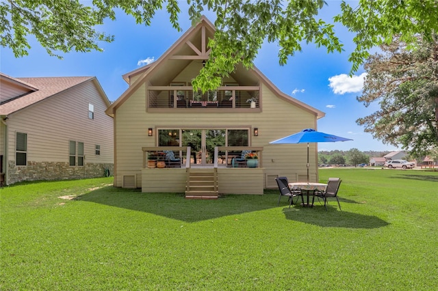 16 Wildwood Lake Dr, Huntsville, TX 77340 - rear view of house featuring a yard and a balcony
