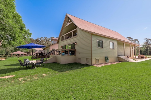 16 Wildwood Lake Dr, Huntsville, TX 77340 - back of house featuring a yard, a deck, and a garage