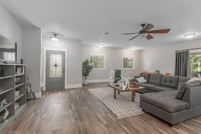 16 Wildwood Lake Dr, Huntsville, TX 77340 - living area featuring wood finished floors, a ceiling fan, and baseboards