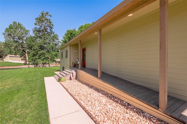 16 Wildwood Lake Dr, Huntsville, TX 77340 - deck featuring a lawn