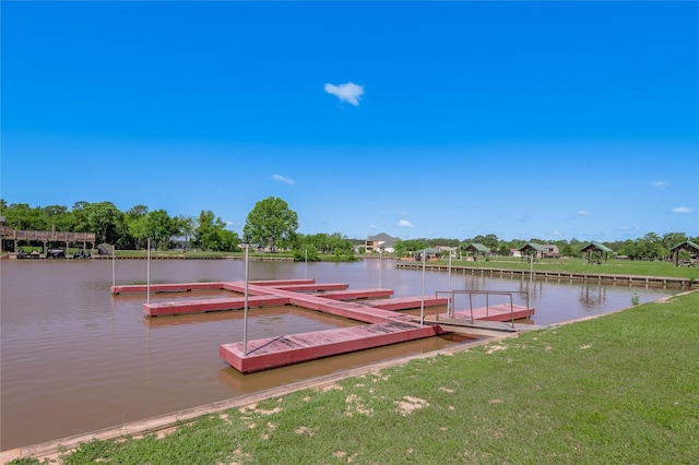 16 Wildwood Lake Dr, Huntsville, TX 77340 - dock featuring a water view and a lawn
