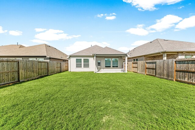 2715 Chestnut Oak Cir, Brookshire, TX 77494 - rear view of house with a patio