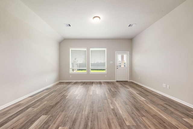 2715 Chestnut Oak Cir, Brookshire, TX 77494 - unfurnished living room featuring wood finished floors and baseboards