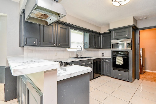 4719 Theall Rd, Houston, TX 77066 - kitchen with appliances with stainless steel finishes, under cabinet range hood, a sink, backsplash, and light countertops