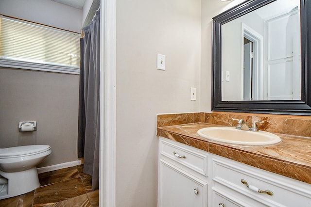 4719 Theall Rd, Houston, TX 77066 - full bathroom featuring toilet, vanity, and baseboards
