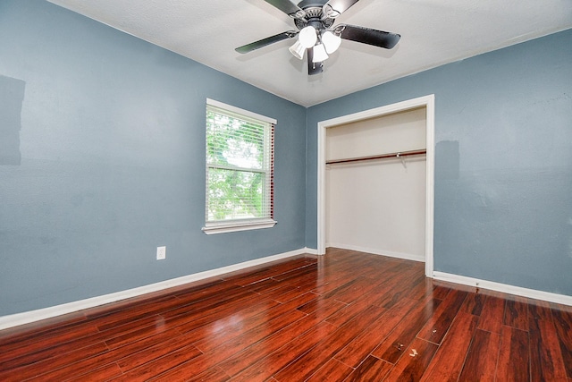 4719 Theall Rd, Houston, TX 77066 - unfurnished bedroom featuring baseboards, wood finished floors, a closet, and ceiling fan