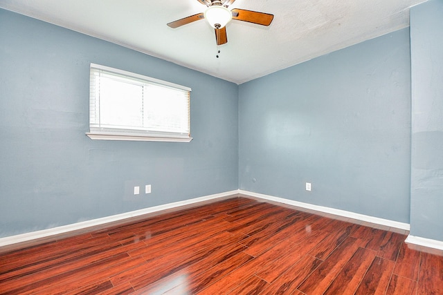 4719 Theall Rd, Houston, TX 77066 - spare room with wood finished floors, a ceiling fan, and baseboards