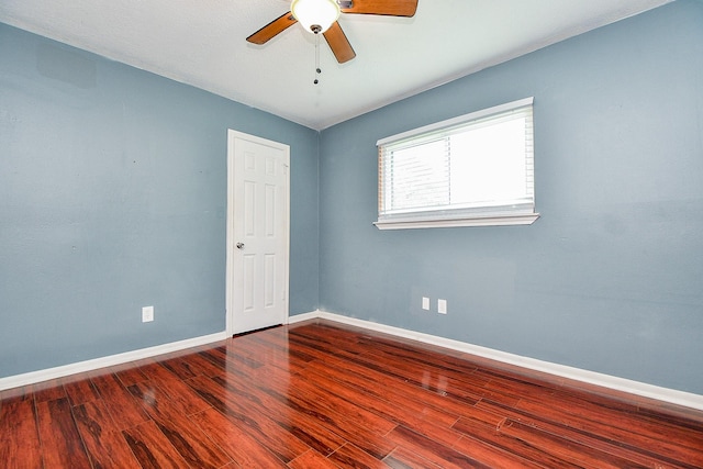 4719 Theall Rd, Houston, TX 77066 - empty room with ceiling fan, wood finished floors, and baseboards