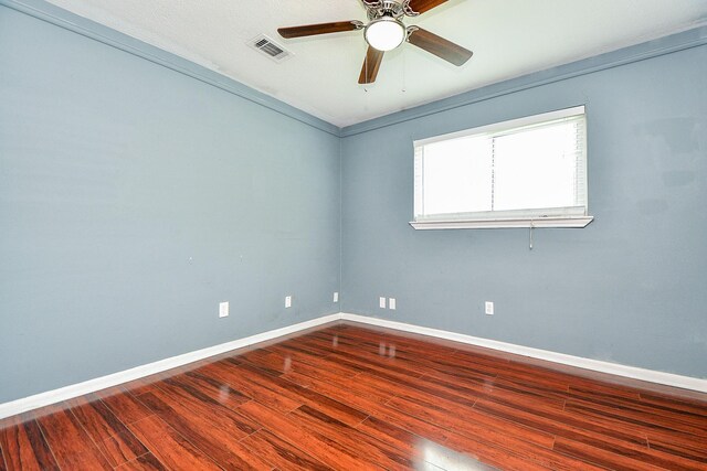 4719 Theall Rd, Houston, TX 77066 - unfurnished room with wood finished floors, ceiling fan, and baseboards