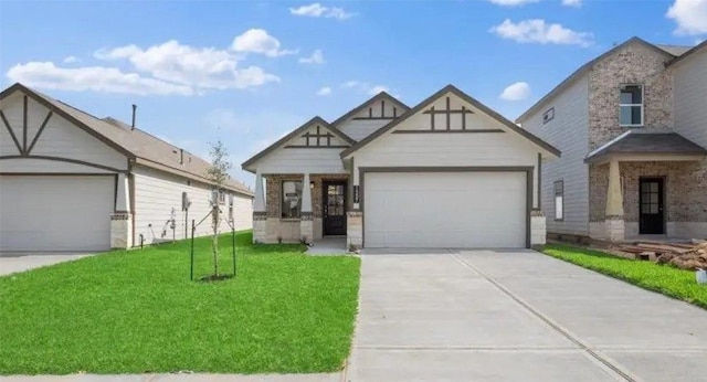 21519 Cypress Trellis Dr, Cypress, TX 77433 - tudor home featuring an attached garage, driveway, a front lawn, and brick siding