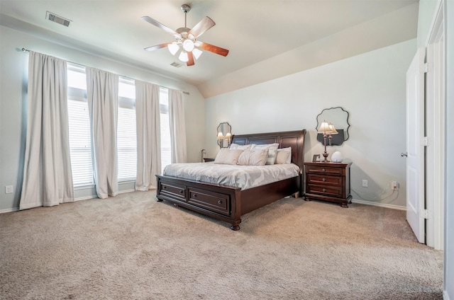 211 Clementine Ct, Montgomery, TX 77316 - bedroom with light carpet, vaulted ceiling, baseboards, and ceiling fan