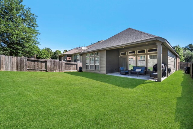 211 Clementine Ct, Montgomery, TX 77316 - rear view of house with an outdoor hangout area, a patio, and roof with shingles