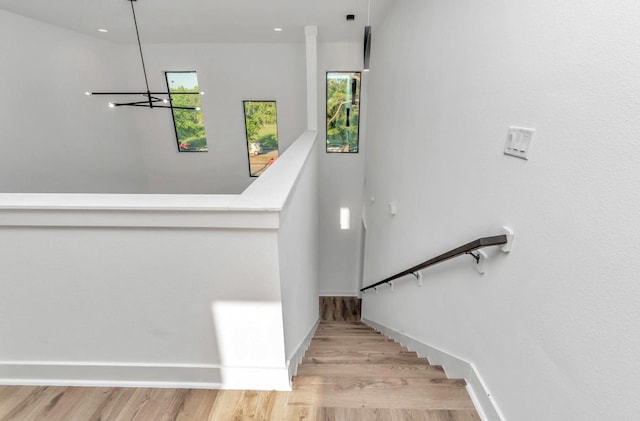 5609 Savyon Dr, Houston, TX 77091 - stairway featuring wood finished floors, baseboards, and recessed lighting