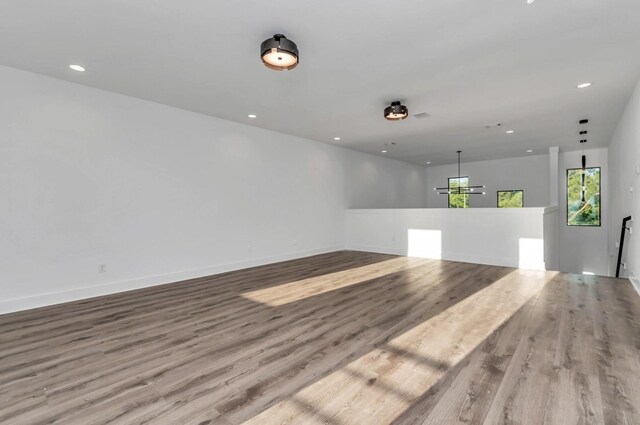 5609 Savyon Dr, Houston, TX 77091 - empty room with wood finished floors, recessed lighting, and baseboards