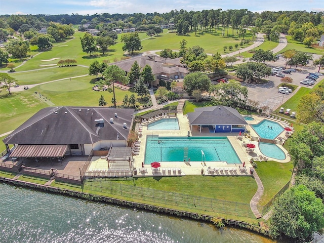 111 Capetown Way, Conroe, TX 77356 - aerial view of a pool area, a nearby body of water, and a golf course