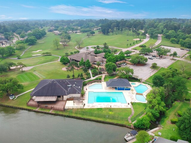 111 Capetown Way, Conroe, TX 77356 - bird's eye view of a pool area and a nearby body of water