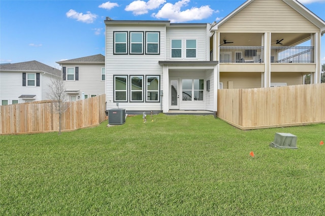 111 Capetown Way, Conroe, TX 77356 - rear view of house featuring a ceiling fan, central AC unit, and a balcony