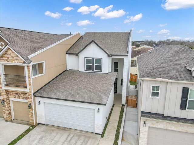111 Capetown Way, Conroe, TX 77356 - townhome / multi-family property featuring roof with shingles, stone siding, driveway, and stucco siding