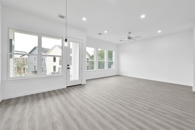 111 Capetown Way, Conroe, TX 77356 - unfurnished living room featuring recessed lighting, wood finished floors, ceiling fan, and baseboards