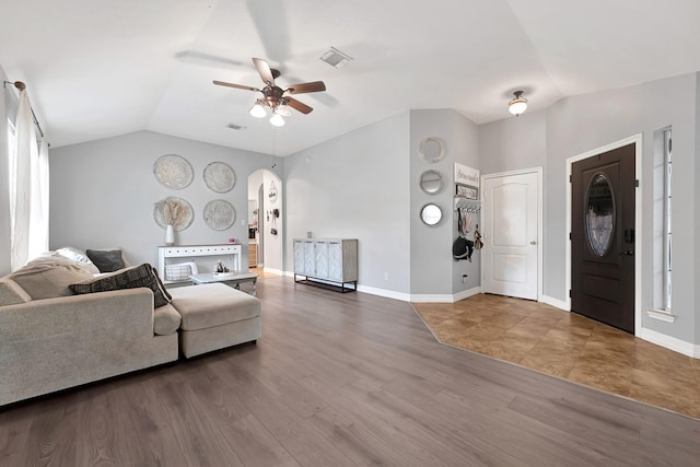 2201 Piney Wood Dr, Deer Park, TX 77536 - living room with arched walkways, ceiling fan, vaulted ceiling, wood finished floors, and baseboards