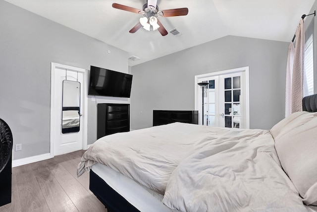 2201 Piney Wood Dr, Deer Park, TX 77536 - bedroom featuring french doors, wood finished floors, lofted ceiling, baseboards, and a ceiling fan