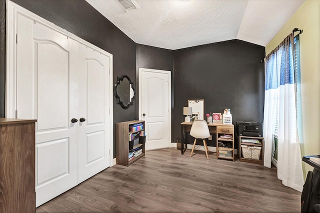 2201 Piney Wood Dr, Deer Park, TX 77536 - office space featuring dark wood-style flooring, a textured ceiling, vaulted ceiling, baseboards, and a textured wall