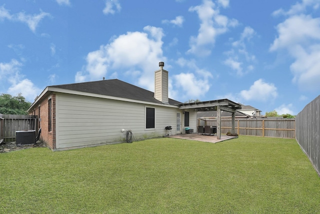 2201 Piney Wood Dr, Deer Park, TX 77536 - rear view of house with a patio area, a chimney, central AC, and brick siding