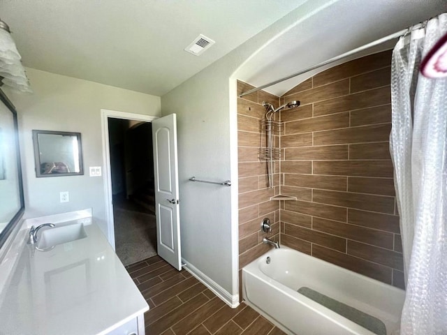 4923 Lacebark Pine Trl, Rosenberg, TX 77471 - bathroom with shower / bath combo, wood tiled floors, double vanity, and baseboards