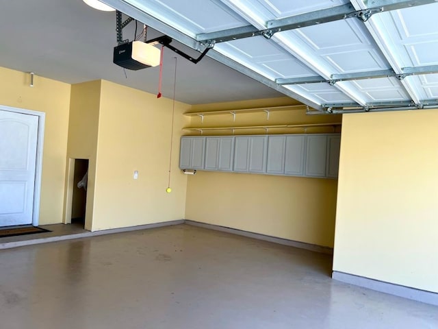 4923 Lacebark Pine Trl, Rosenberg, TX 77471 - garage featuring baseboards and a garage door opener