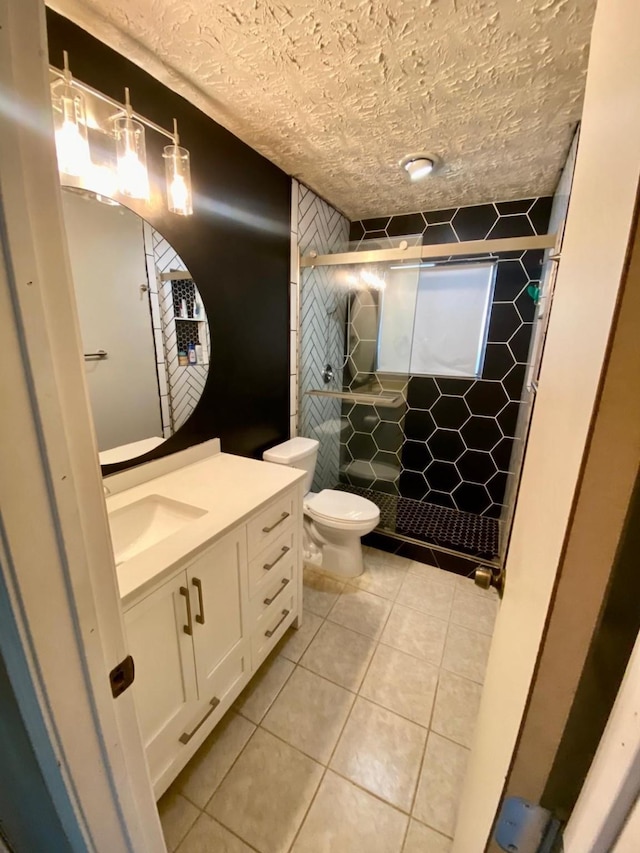 1903 Barons Gln, Sugar Land, TX 77478 - full bathroom with toilet, a shower stall, vanity, tile patterned flooring, and tile walls
