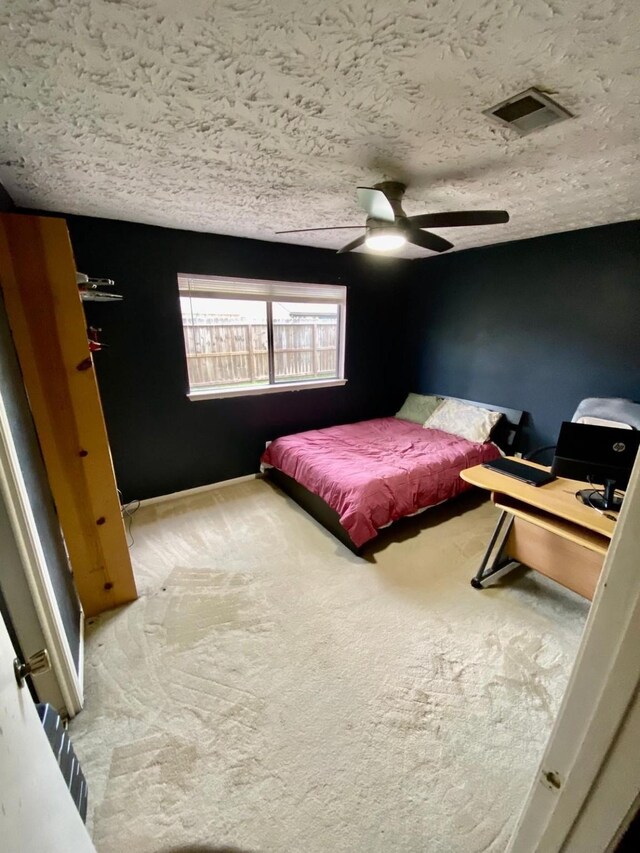 1903 Barons Gln, Sugar Land, TX 77478 - bedroom featuring carpet flooring, a textured ceiling, and a ceiling fan