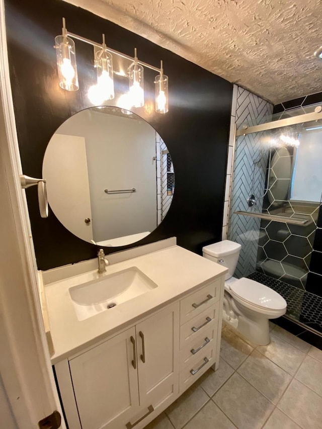 1903 Barons Gln, Sugar Land, TX 77478 - bathroom with tile patterned flooring, a stall shower, toilet, vanity, and a textured ceiling